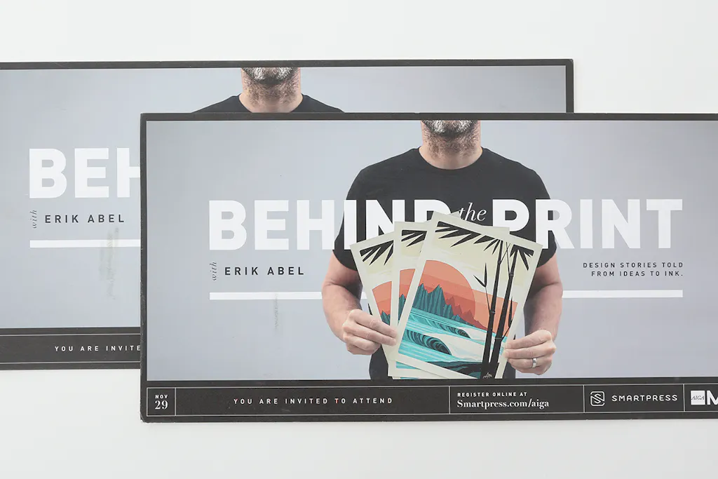Two custom postcards printed with a man holding posters and Behind the Print With Erik Abel.