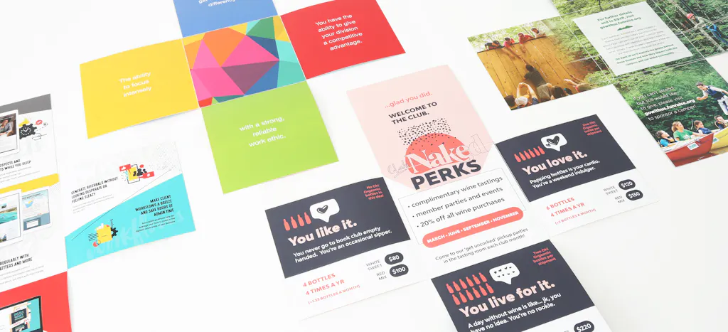 Four direct mail pieces unfolded with various marketing designs in multiple colors.
