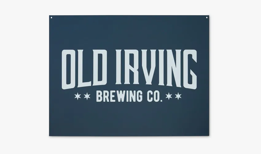 A custom aluminum sign printed with a dark blue background and Old Irving Brewing Co. in white.