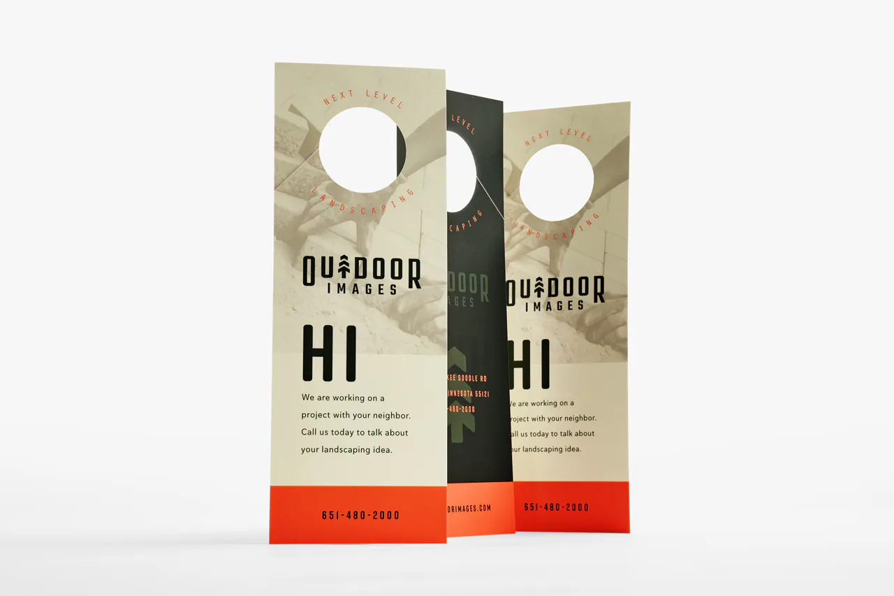 Three custom door hangers printed with Next Level Landscaping and an orange, tan and dark green design.