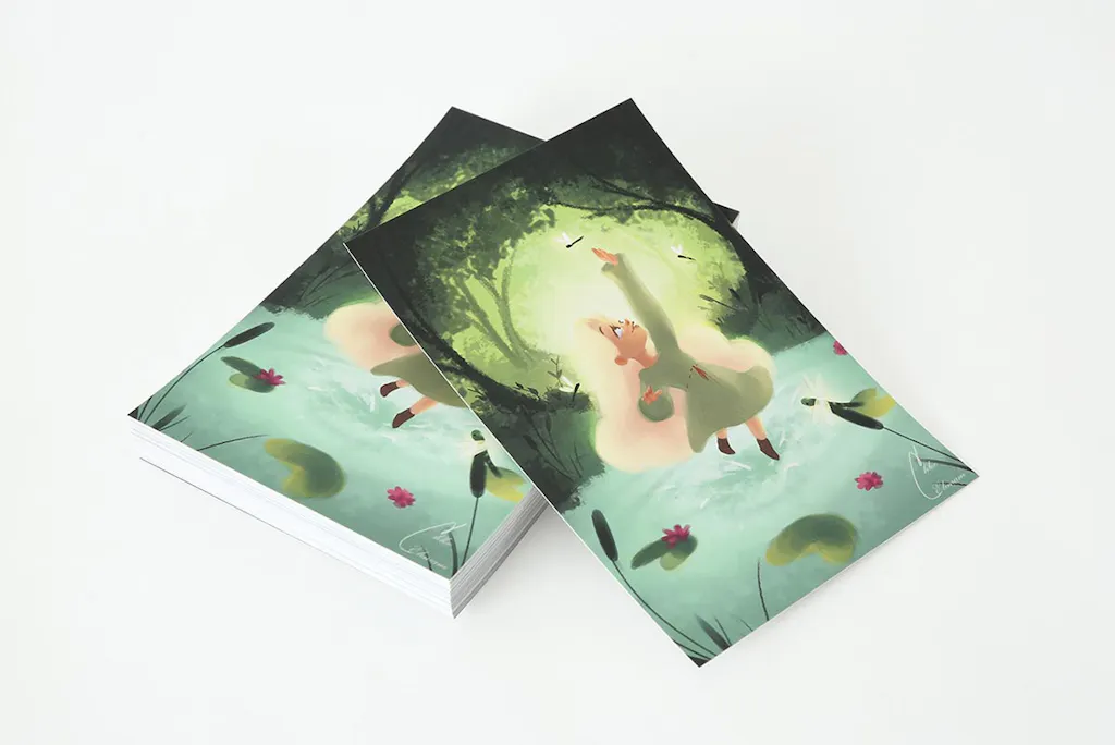 A stack of custom postcards with illustrations of a little girl in a forest reaching for fireflies.