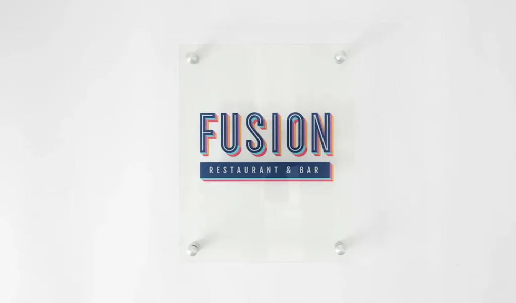 An acrylic sign with Fusion Restaurant & Bar in blue and orange.