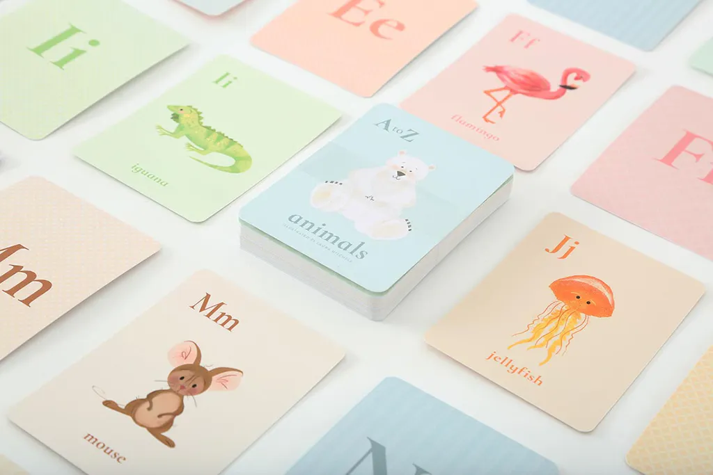 Custom flashcards printed with graphics of animals and uppercase and lowercase letters.