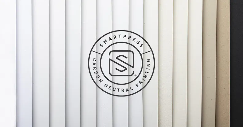 The Smartpress Carbon Neutral Printing logo over fanned-out paper stocks with neutral colors from white to black.