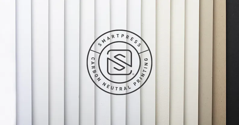 The Smartpress Carbon Neutral Printing logo over fanned-out paper stocks with neutral colors from white to black.