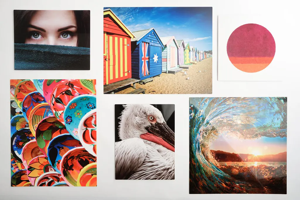 Six metal prints in various sizes and custom artwork lined up in rows.