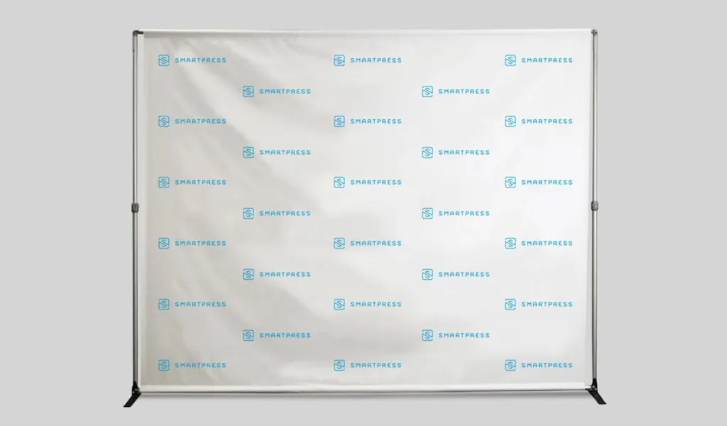 A step and repeat banner with the Smartpress name and logo in blue.