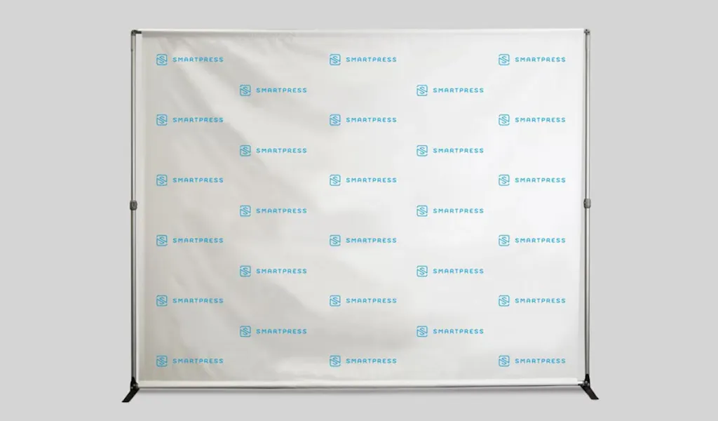 A step and repeat banner with the Smartpress name and logo in blue.