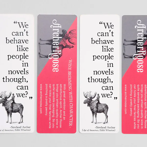 Four custom bookmarks lined up with a pink and gray design and a moose illustration.